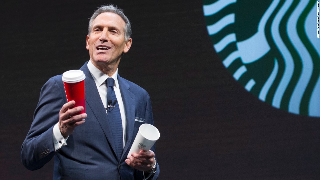 Schultz holding Starbucks cups