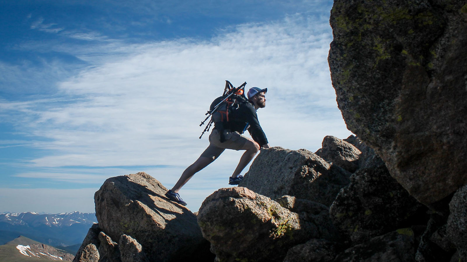 Man climbing boulders