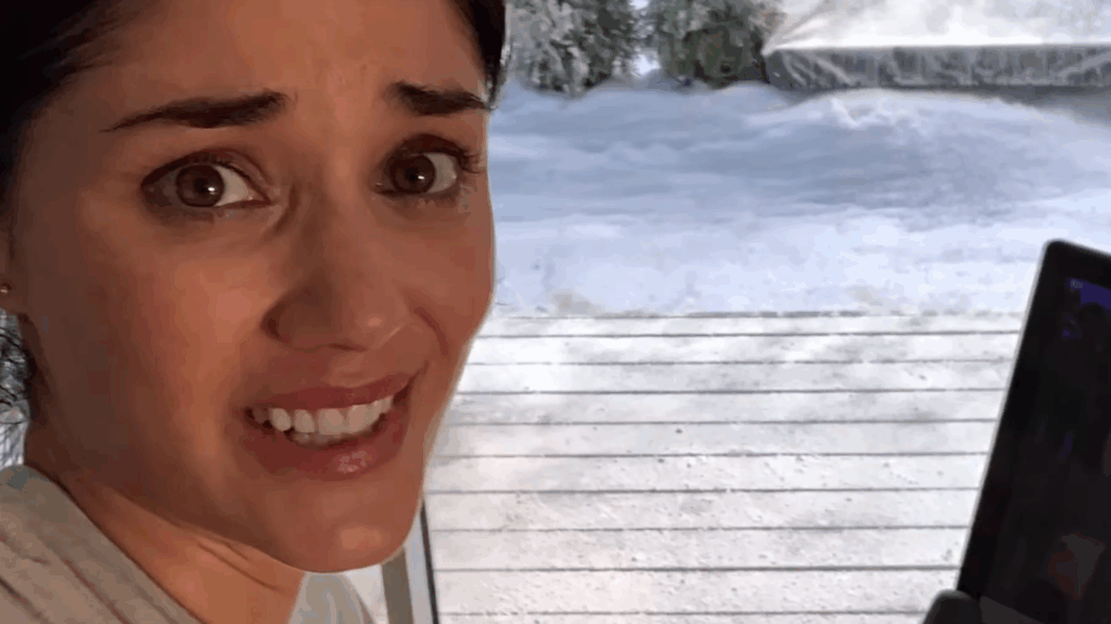 Concerned face by a window with snow in the background