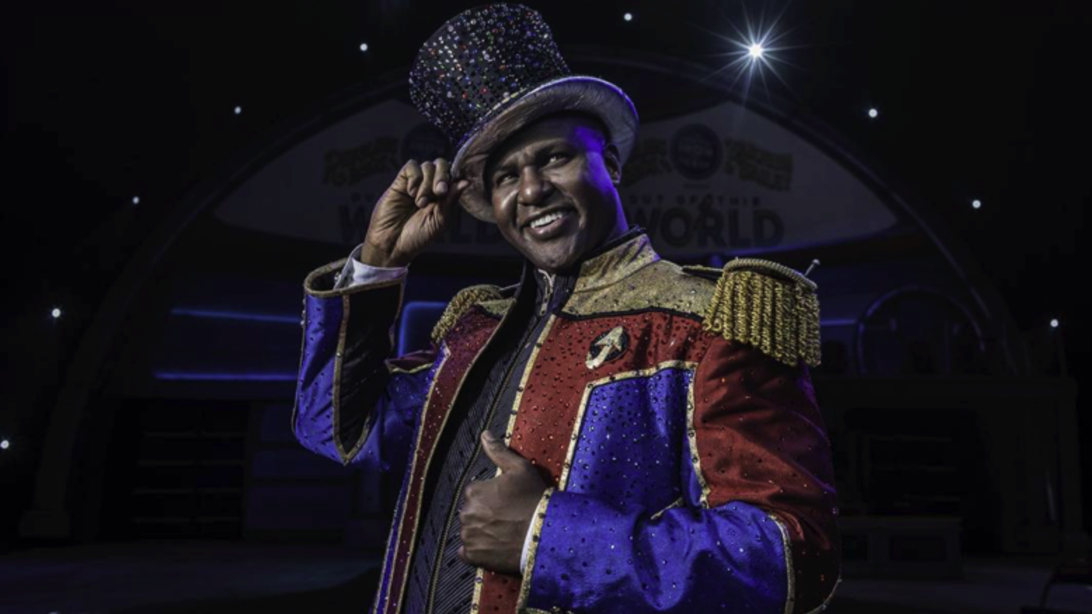 Person at circus in a sparkly hat and attire