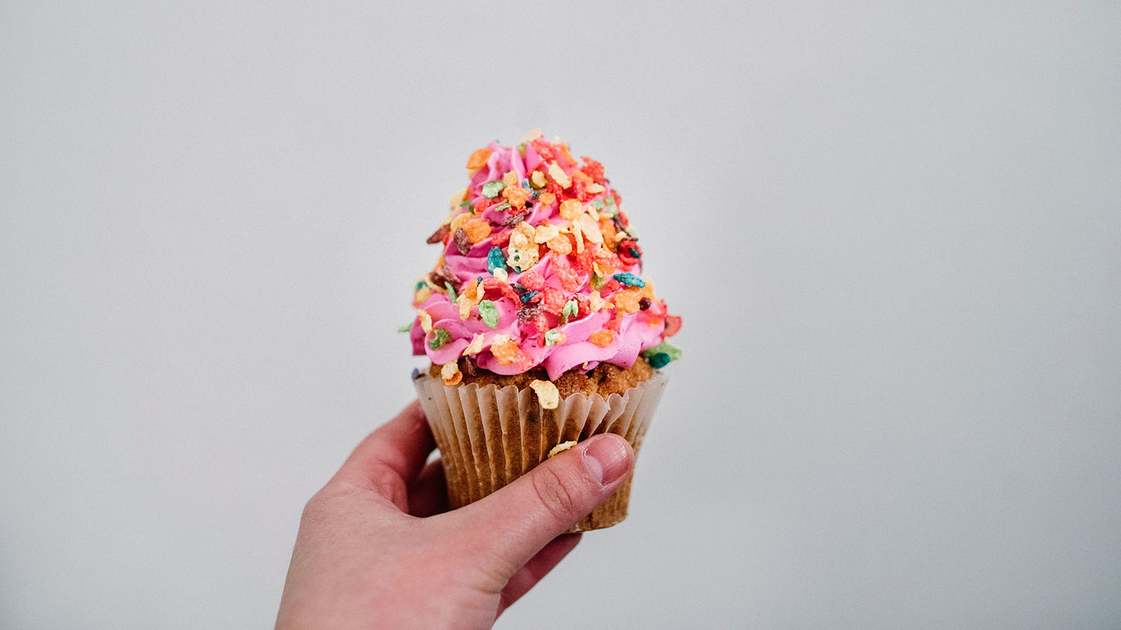 A cupcake with cereal on top