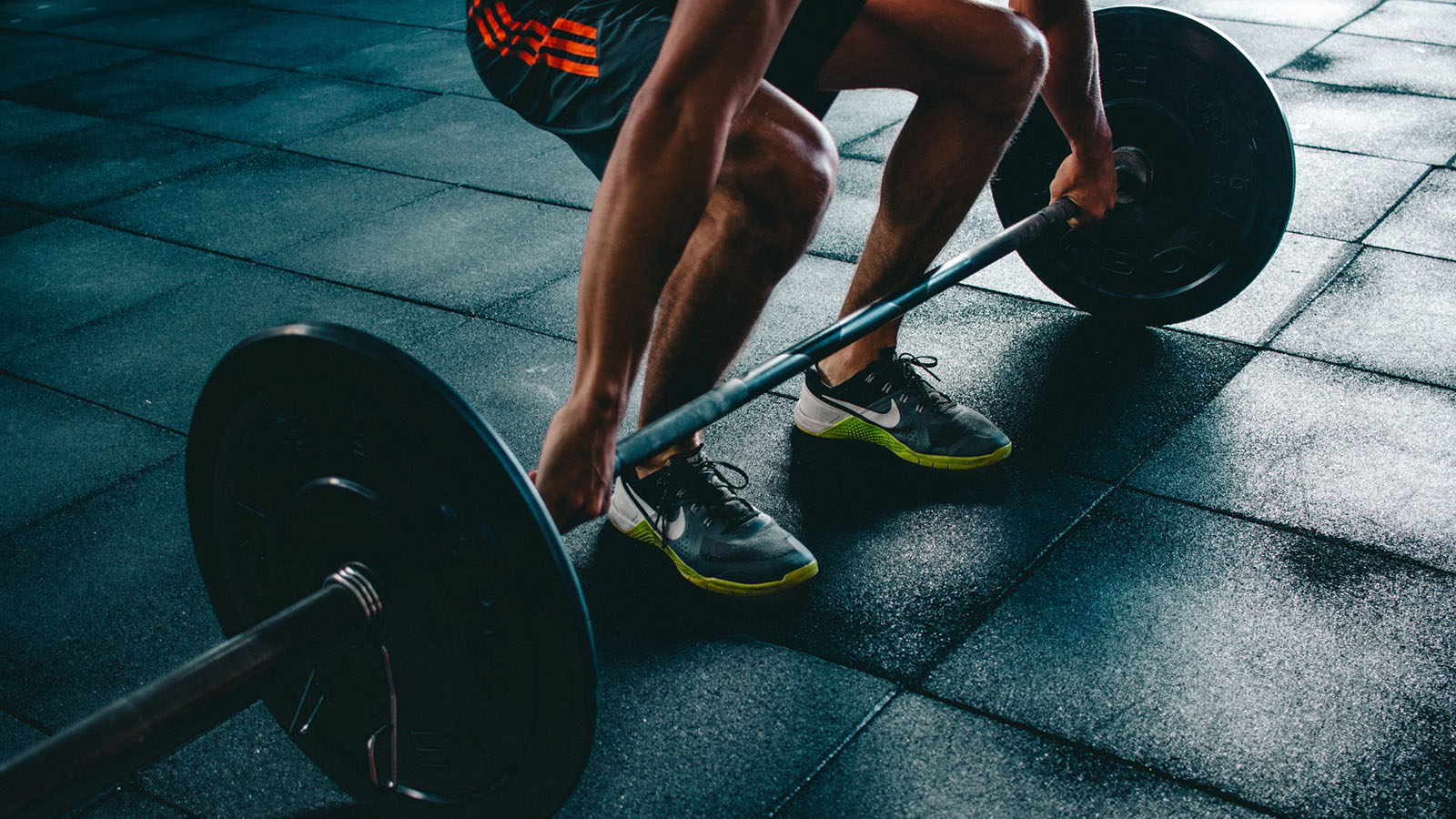 Person getting in position to lift a barbell